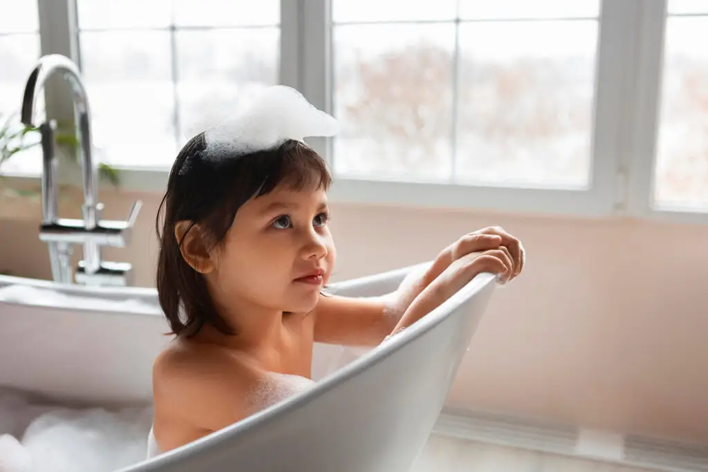 Child enjoying a bubble bath